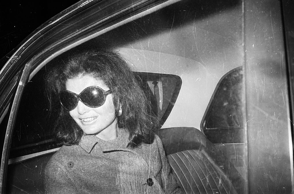 Jacqueline Onassis (1929 - 1994), wife of Greek shipping tycoon Aristotle Onassis and former wife of assassinated US president John F Kennedy, at London Airport.